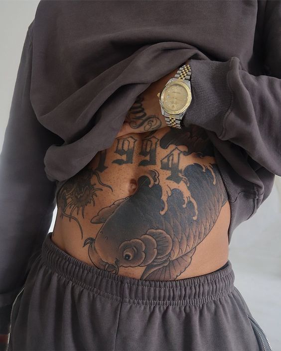 18 Unique Stomach Tattoo Ideas for Men: Inspiring Designs from Tribal Symbols