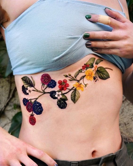 Side Stomach Tattoos for Women Featuring Stunning Flowers and Meaningful Words